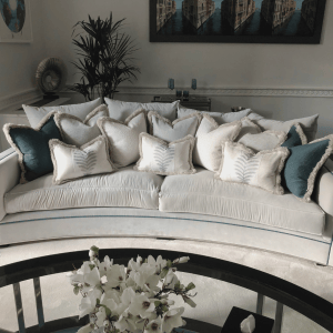 White and green luxury cushions on a white sofa